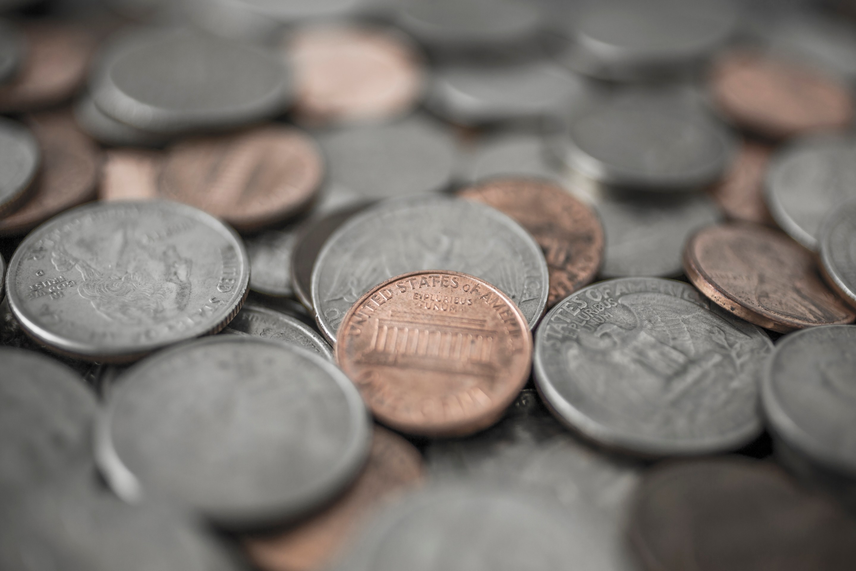 Loose change, pennies, nickels, dimes and quarters